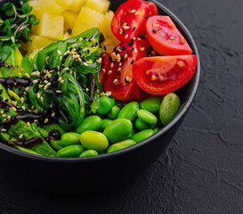 bowl with seaweed, beans, avocado and pineapple
