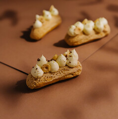 eclairs with whipped cream and hazelnuts