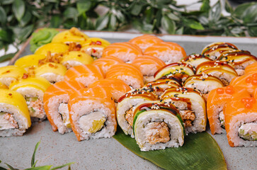Sushi set of different rolls on big plate