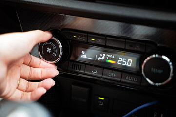 Fototapeta premium Button to increase and decrease the air conditioner in the car