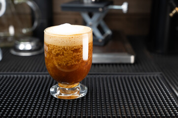 Latte menu in a glass ready to be served to customers.