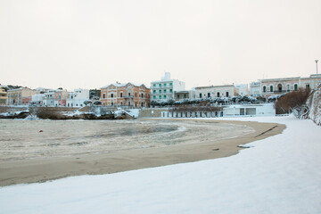 Santa Maria al Bagno beach after a exceptional snowfall, Salento, Apulia, Italy
