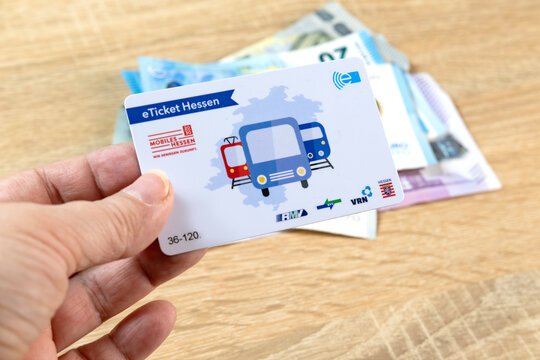 female hand holds electronic eTicket Germany, plastic monthly travel card, Digital Transformation in Transit, Public Transportation Technology, Frankfurt - December 3, 2023