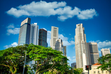 Fototapeta na wymiar Singapore city skyline of business district downtown on blue sky with cloud in daytime.