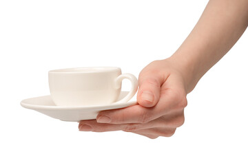 Female hand holding coffee cup and saucer isolated on white background.
