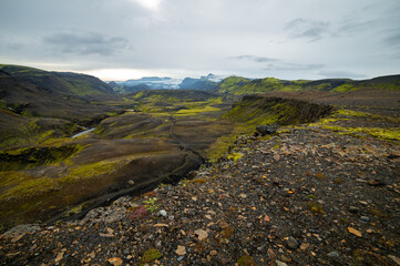 Amazing Icelandic landscape with mountains and field on a cloudy day at famous Laugavegur hiking trail, South Iceland. Acid colours landscape.