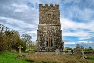 Fototapeta na wymiar Whitcombe church, in the parish of Whitcombe, Dorset, England. Dating from the 12th Century, this medieval church is in the Norman perpendicular style.