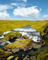 Long exposure view of famous waterfalls of river Skógá. Skógafoss. Magnificent Iceland in august. Fimmvörðuháls Hiking Trail. Popular Travel destinations.