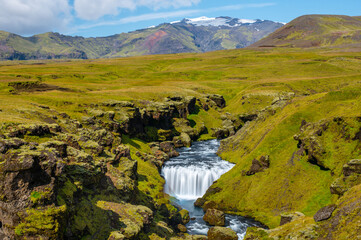 Long exposure view of famous waterfalls of river Skógá. Skógafoss. Magnificent Iceland in...