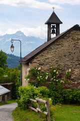 Small chapel in a village while hiking Tour du Mont Blanc. Alps, Chamonix-Mont-Blanc, France,...