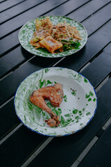 Nasi pecel dan ayam goreng or Pecel rice and fried chicken.
Traditional Javanese rice dish of steamed rice with vegetable salad, peanut sauce, omelet, tofu and crackers.