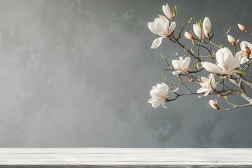 empty wooden table top with blooming white magnolia flowers,on a light gray background,place for...