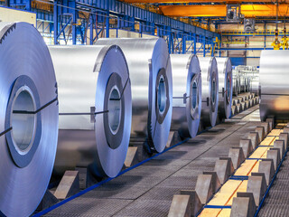 Rolls of sheet steel in selective focus. Cold rolled and hot rolled steel products for...