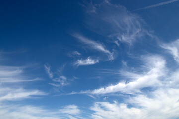 White fluffy clouds in the blue sky.