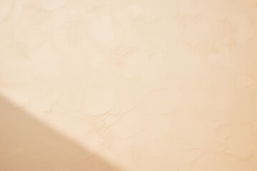 Beige wall with shadows on it, top view, flat lay background texture
