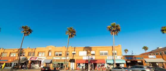 Fototapeta na wymiar stores under a blue sky in Newport seafront