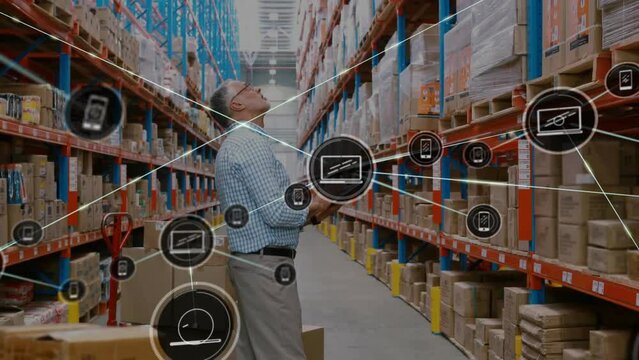 Animation of network of media icons over caucasian male manager inspecting goods at warehouse