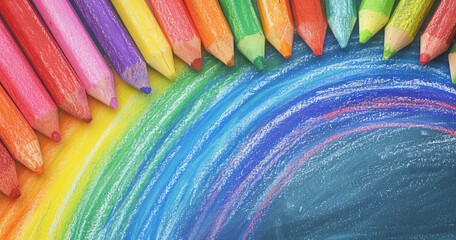 Group of Colored Pencils With Rainbow in the Middle