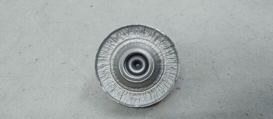 A part of a round part split across as a result of multiple heat treatment