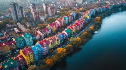 Papier Peint photo Paris A picturesque aerial view showcasing a residential area along Kyiv's riverfront, where brightly colored houses create a rainbow-like mosaic against the urban landscape
