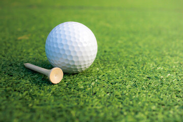 Golf ball placed on artificial grass.