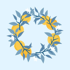 Fototapeta na wymiar Composition of blue branches and leaves with oranges in a circle