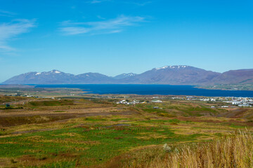 Icelandic landscape with mountains and fjord in summer.