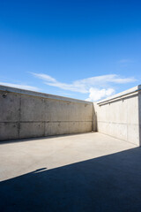 Concrete staircase leading up onto a bridge.
