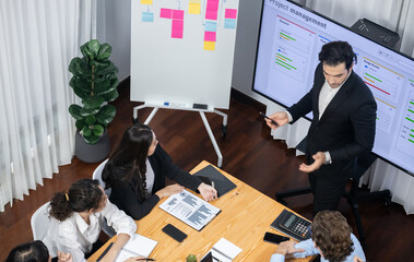 Project manager planning schedules for business task at meeting room, Gantt chart software show on...