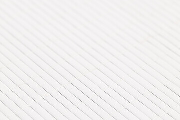 White abstract background made of stitched wooden strips forming a tablecloth