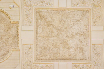 Brightly decorated stucco ceiling with a fire alarm