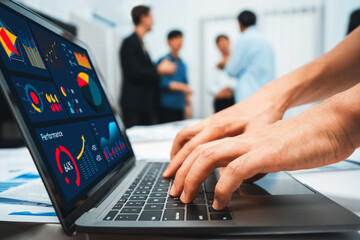 Analyst team uses BI Fintech on a laptop to analyze financial data on blurred background. Business people analyze BI dashboard for insights power into business marketing planning. Prudent - obrazy, fototapety, plakaty