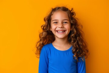 Joyful Radiance: Captivating Image of an Excited Girl in a Blue Top, Beaming with Smiles and Laughter Against an Isolated Orange Background, with Ample Empty Space for Creativity. generative ai