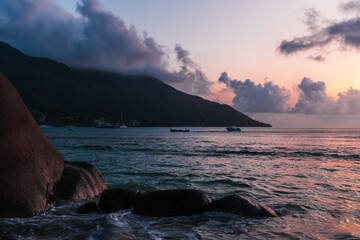 Beau Vallon Beach landscape, shore water and wet coastal rocks