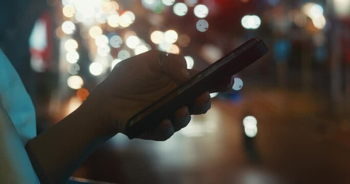 In urban traffic background hand holds phone with online maps Navigation essential for city life. Navigation easing movement through busy streets Navigation guiding through sleepless city.