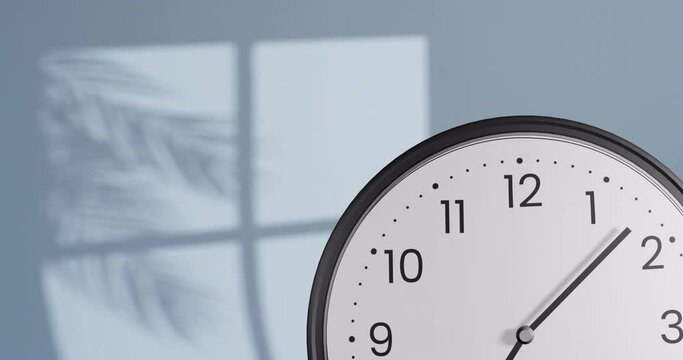 Animation of fast moving hands on clock over wall with shadow of leaves and window