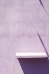Lilac wall with shadows on it, top view, flat lay background