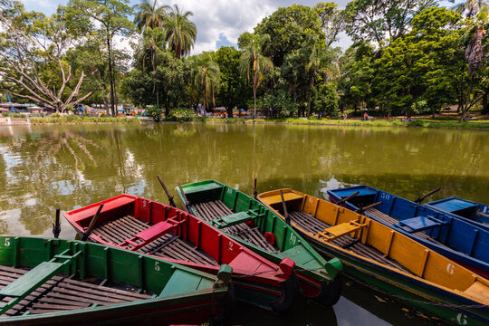 Belo Horizonte Municipal Park, during a beautiful sunny day with the sky's clouds reflected in the lake.