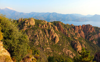 scenery of the red rocks called  Badlands or Calanches in Corsica in France without people