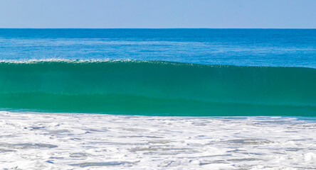 Fototapeta na wymiar Extremely huge big surfer waves at beach Puerto Escondido Mexico.