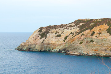 Naklejka premium Landscape of Crete island. Rocks on the seashore. View of the Cretan Sea. The beach of Made near famous resort of Agia Pelagia, Ligaria, Heraklion, Greece. 