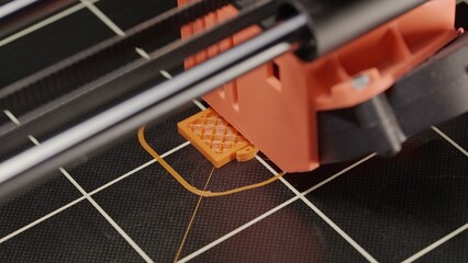 The process of printing a part on a 3D printer, close-up. Watch as our printer brings each tiny...
