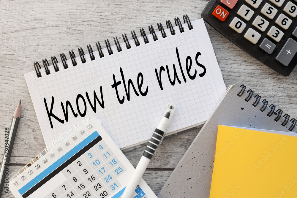 Poster know the rules text on a notepad near the calendar. business process regulation concept.