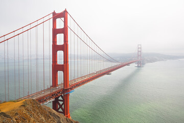 Fototapeta na wymiar Golden Gate Bridge, the symbol of San Francisco city on a foggy day - California - USA