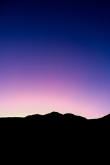 Morning Twilight over Silhouetted Mountain Range - New Zealand Travel Background