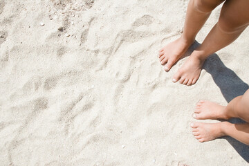 A Feet on the sand of happy people by the sea on nature travel