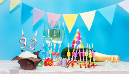 Date of birth with candles and number  92. Anniversary greeting card. Holiday decorations. Happy...