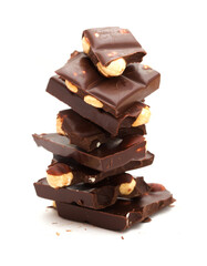 A bar of dark chocolate with hazelnuts isolated on white background 
