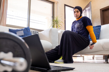 muslim woman doing exercises in home