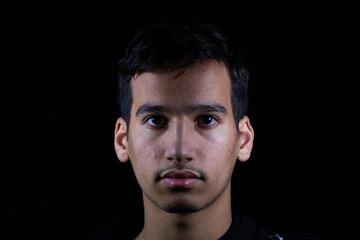 Portrait for teenager in dark and light studio